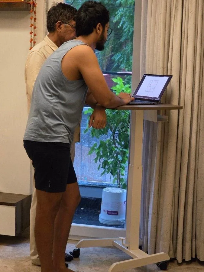 Frido portable standing desk — height-adjustable table shared by the family